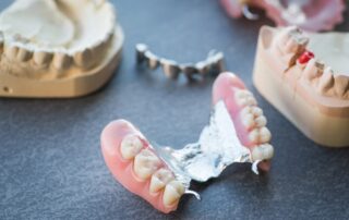 A Guide To Cleaning And Caring For Dentures 320x202